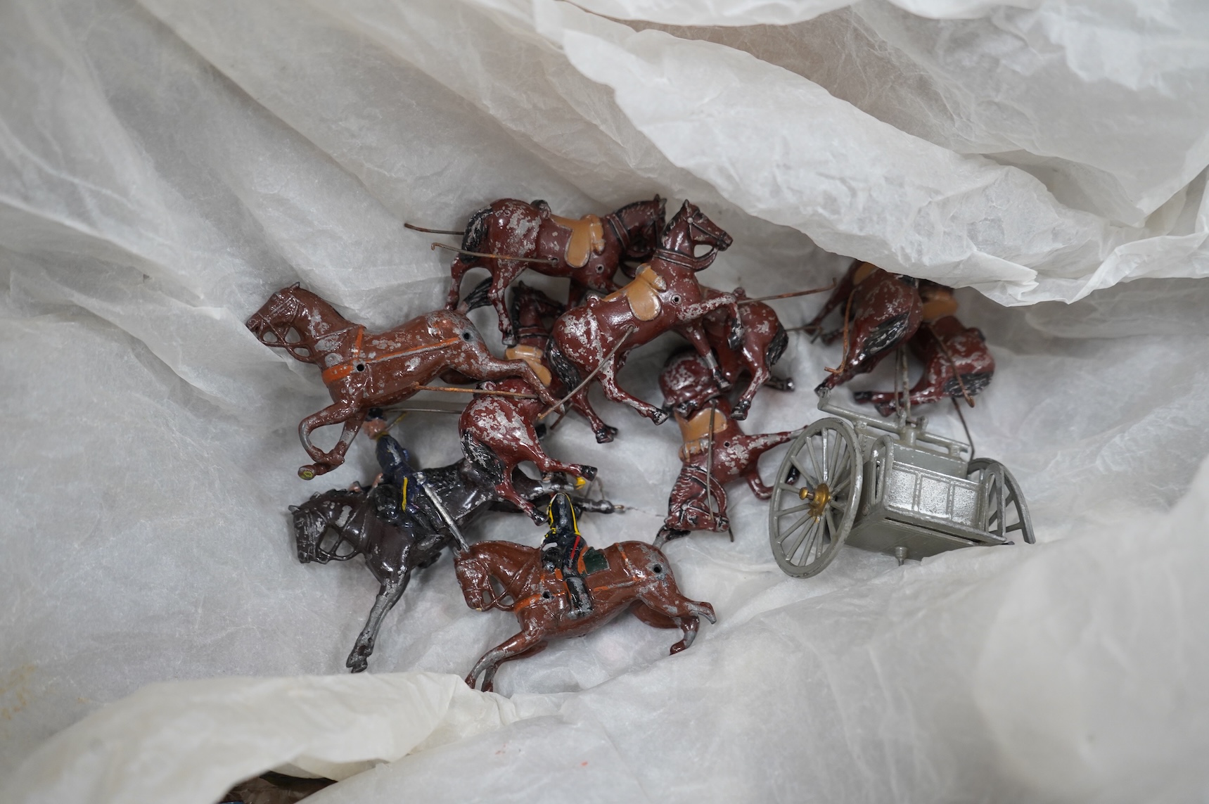 A quantity of Britains lead soldiers, including some pre-war examples, comprising twenty mounted soldiers including lancers, hussars, guards, etc. a quantity of foot soldiers including guards, bandsmen, Highlanders, Scot